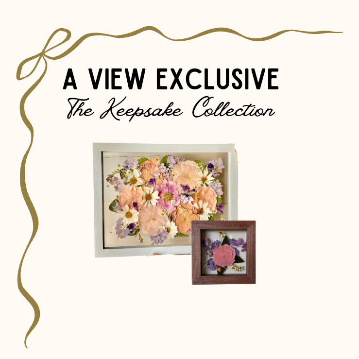 Advertisement for 'A View Exclusive' Keepsake Collection featuring framed floral arrangements.
